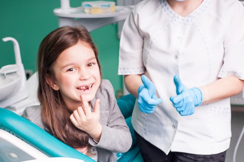 young girl in dental chair